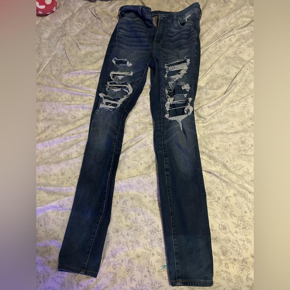 American Eagle jeans high-rise with patches over rips; size 8